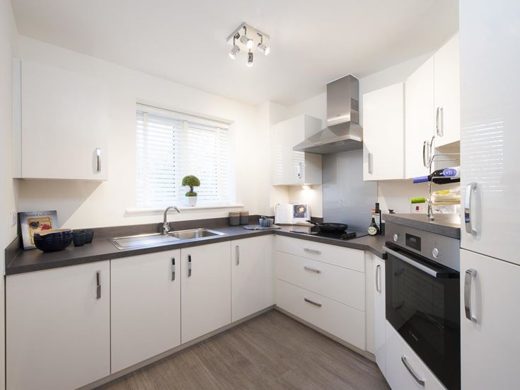a kitchen with white cabinets