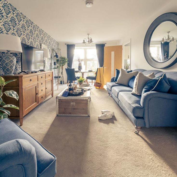 a living room with a blue couch