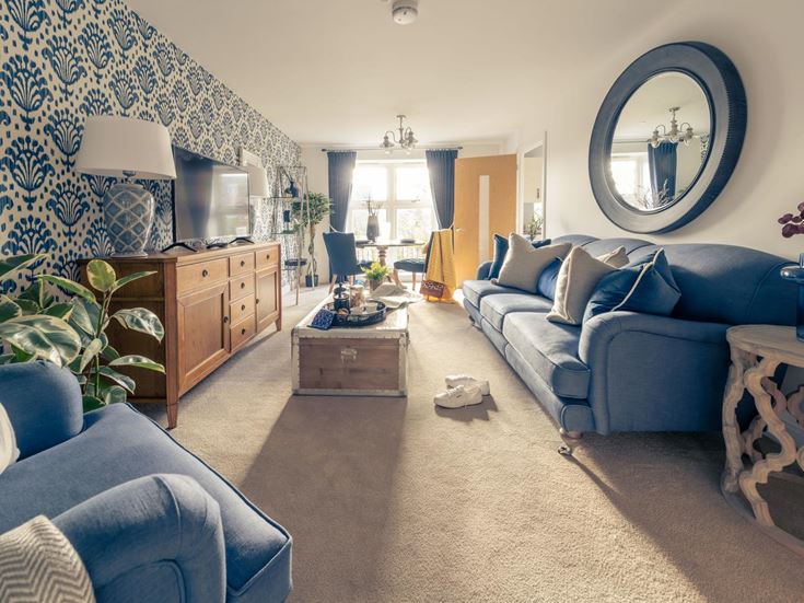 a living room with a blue couch
