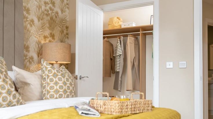 a bed with a yellow bed spread