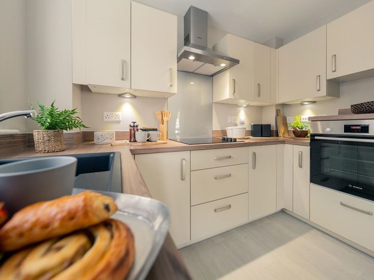 a kitchen with white cabinets