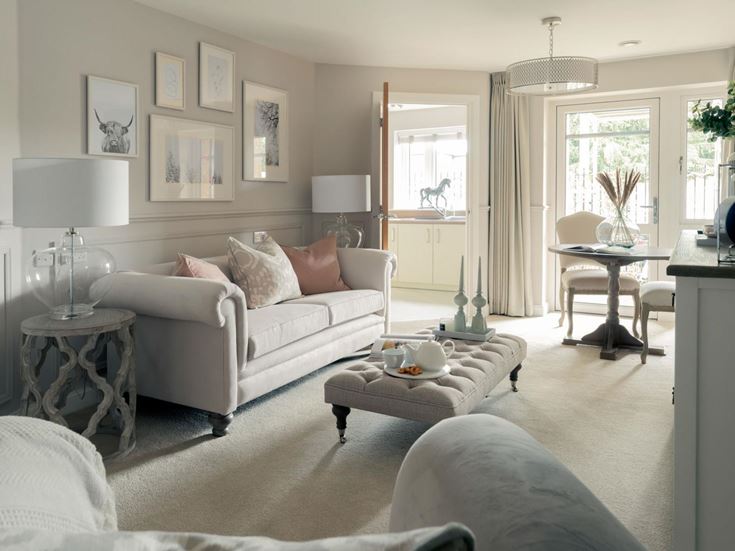 a living room with a white couch and a table