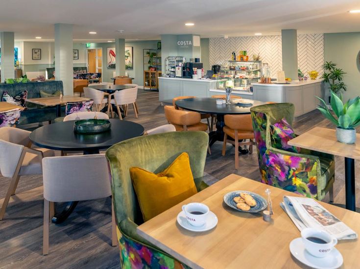 a restaurant with tables and chairs