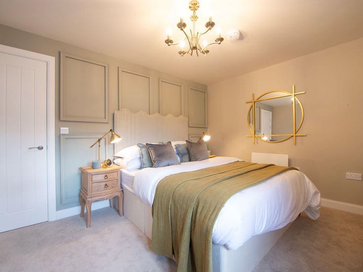 a bedroom with a large mirror