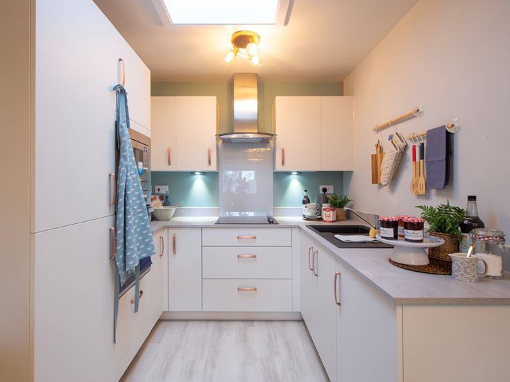a kitchen with white cabinets