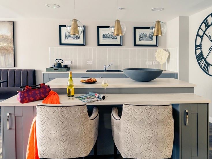 a kitchen with a table and chairs