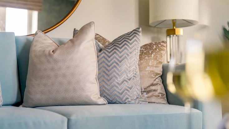 a couch with pillows and pillows