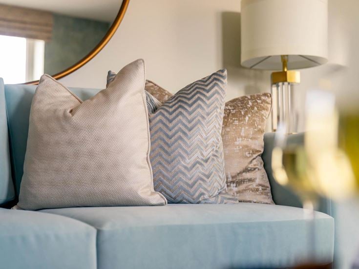 a couch with pillows and pillows