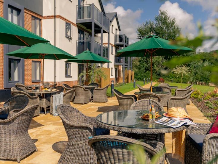 a patio with tables and chairs