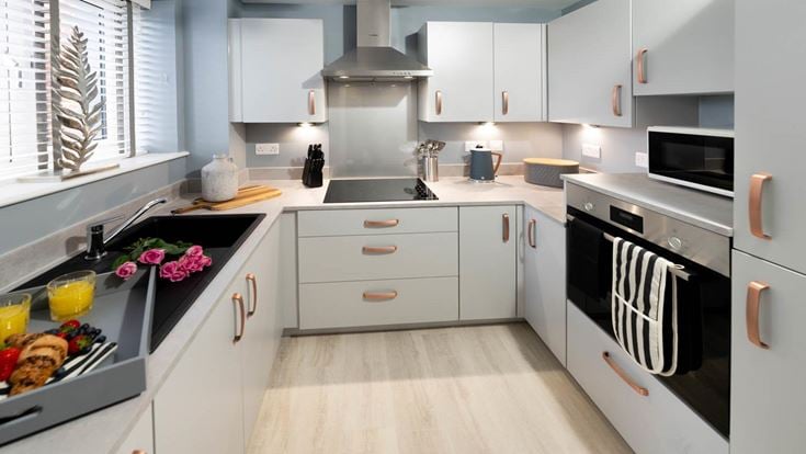 a kitchen with white cabinets