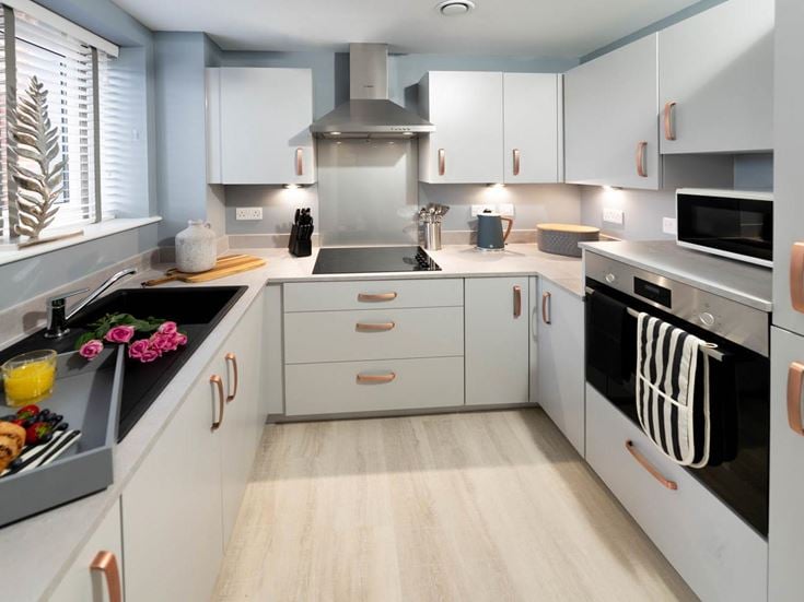 a kitchen with white cabinets