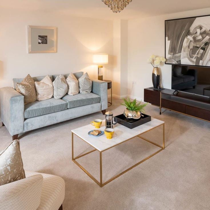a living room with a tv and couches