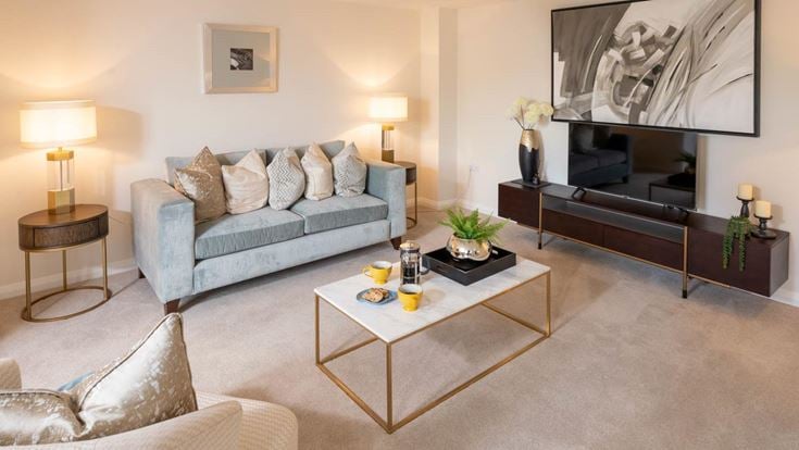 a living room with a tv and couches