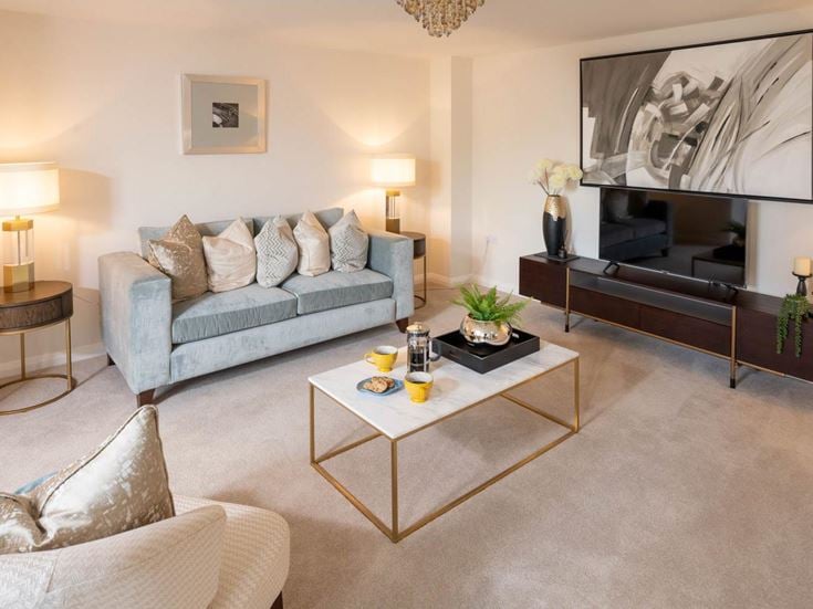 a living room with a tv and couches