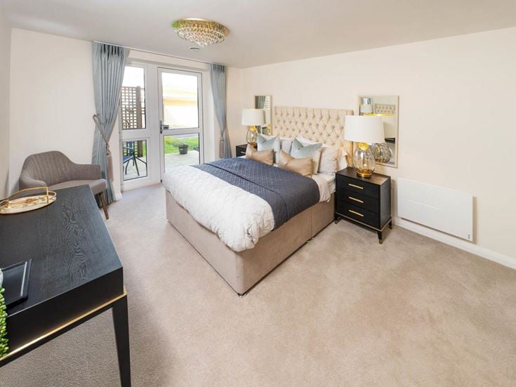 a bedroom with a bed and a table