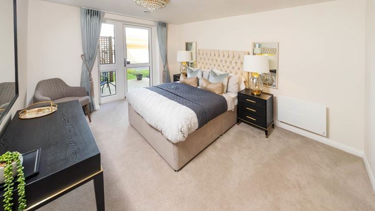 a bedroom with a bed and a table