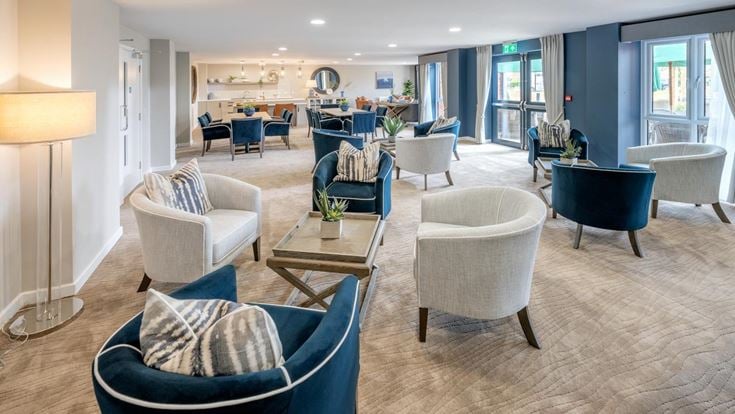 a room with a table chairs and a couch