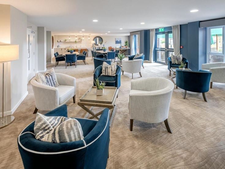 a room with a table chairs and a couch