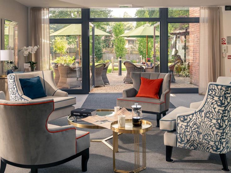 a living room with a table and chairs