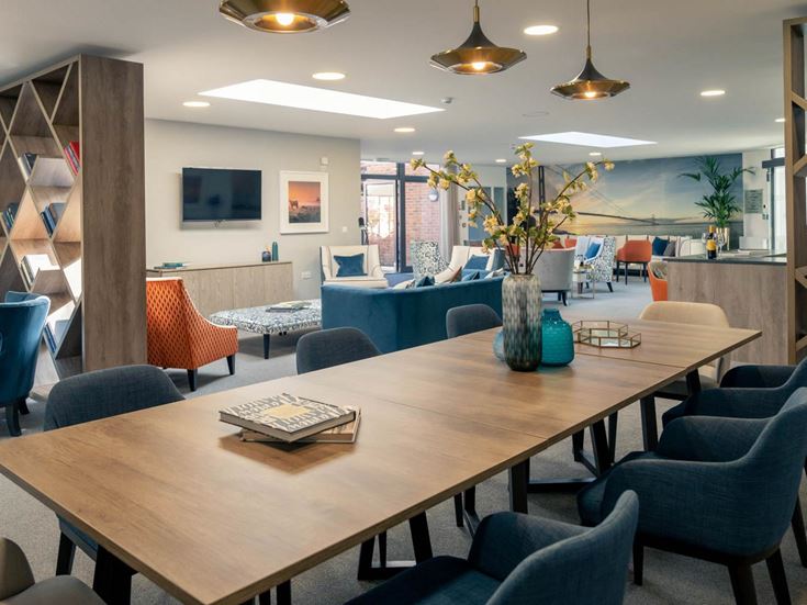 a large room with a table and chairs