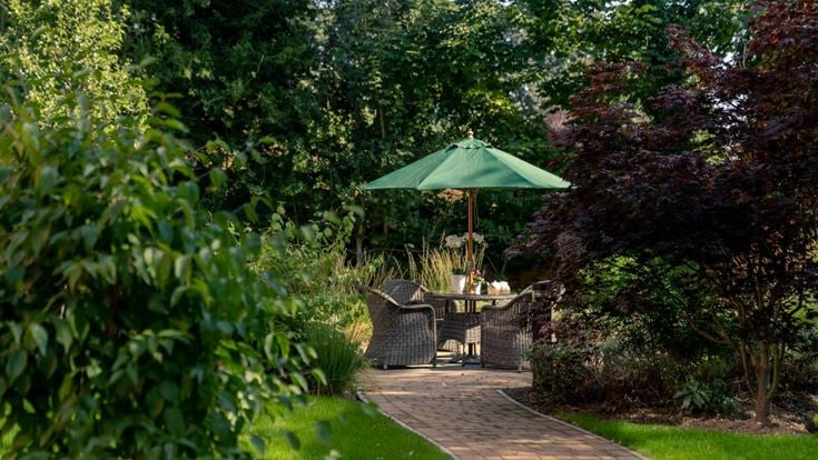 a patio with a table and chairs