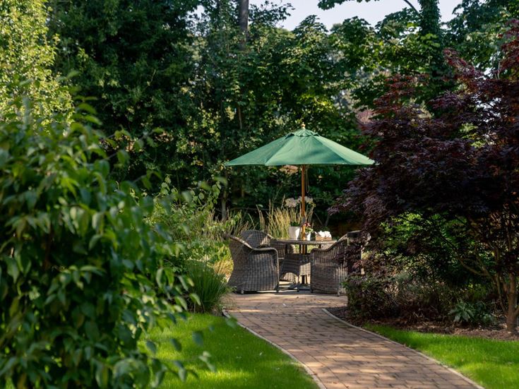 a patio with a table and chairs
