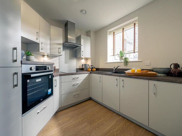 a kitchen with white cabinets