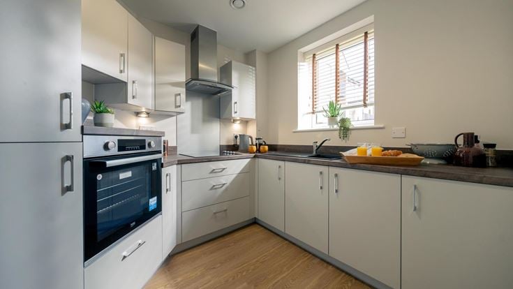 a kitchen with white cabinets