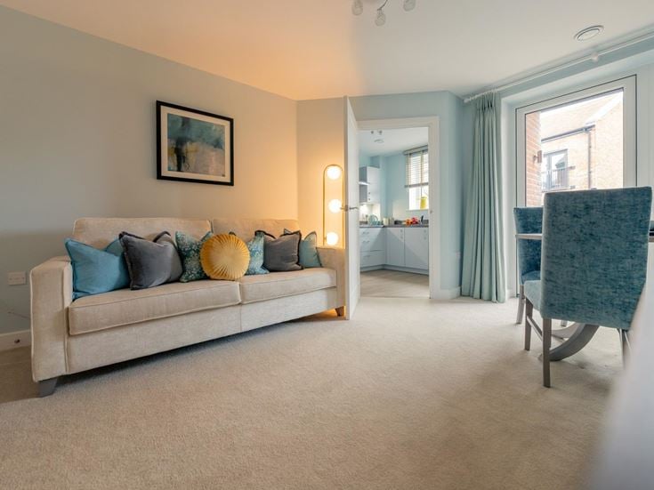 a living room with a couch and a table