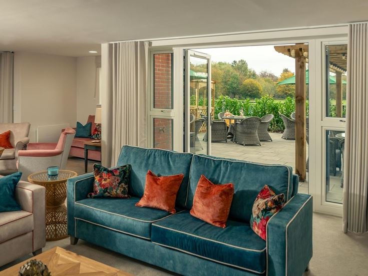 a living room with a blue couch
