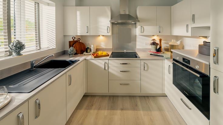 a kitchen with white cabinets
