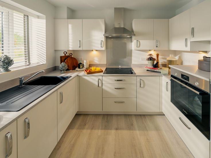 a kitchen with white cabinets