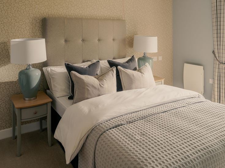 a bed with white sheets