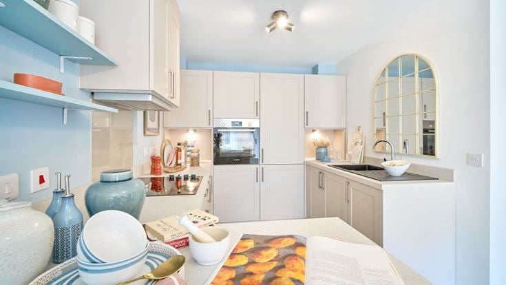a kitchen with white cabinets