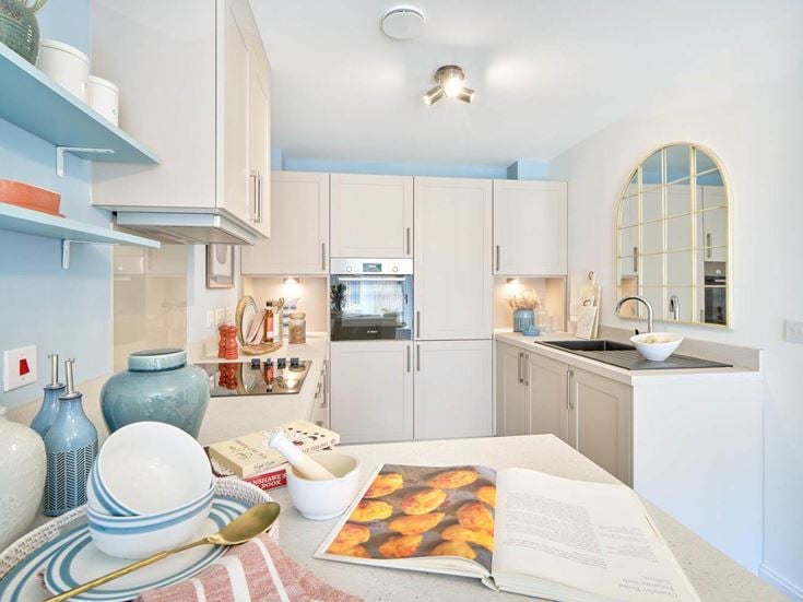 a kitchen with white cabinets