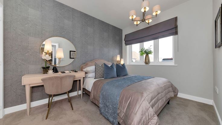 a bedroom with a bed and a table