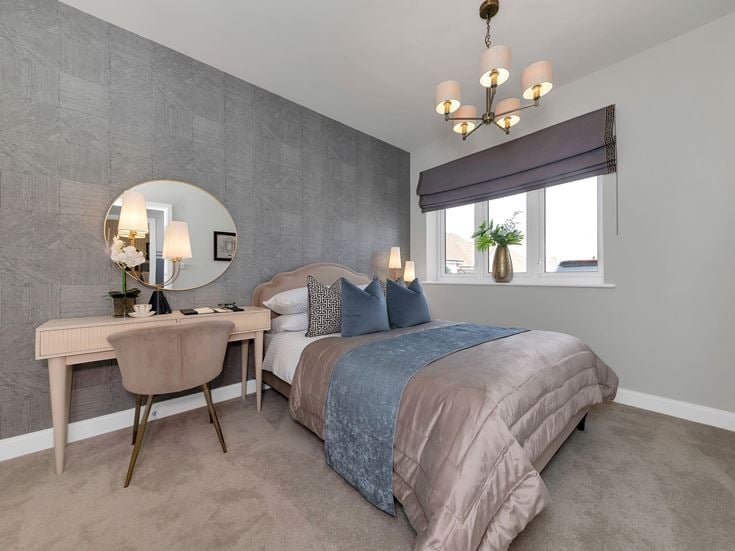 a bedroom with a bed and a table