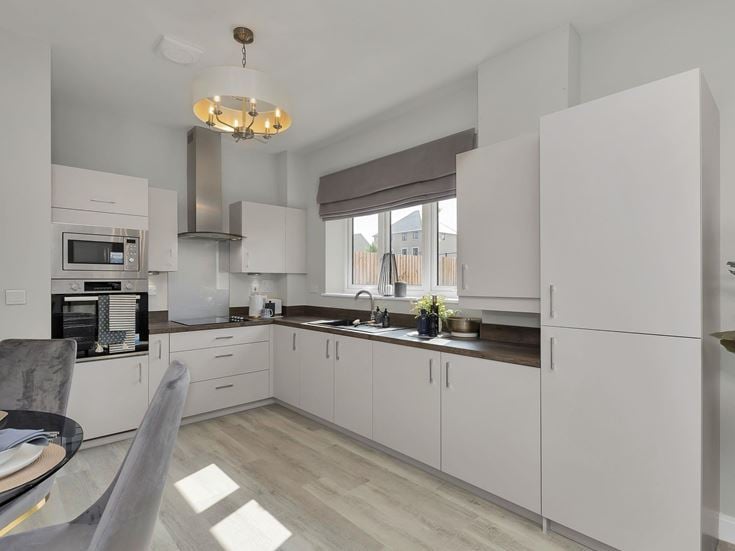 a kitchen with white cabinets