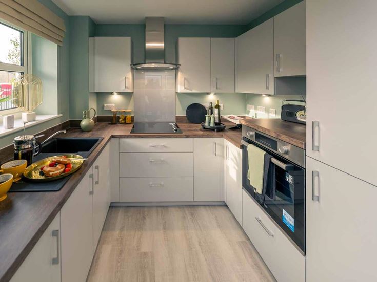 a kitchen with white cabinets