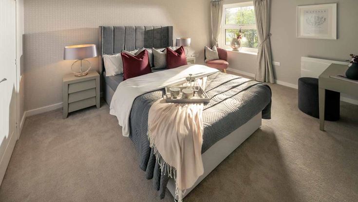 a large bedroom with a large bed