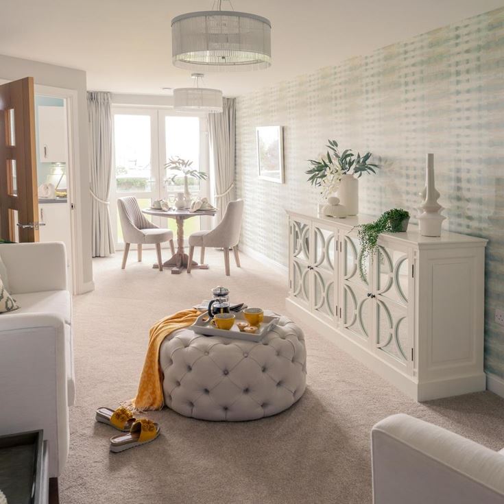 a living room with a white couch and a table
