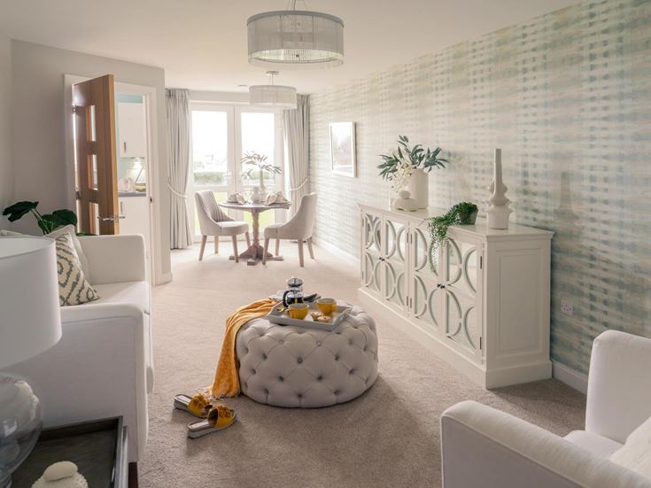 a living room with a white couch and a table
