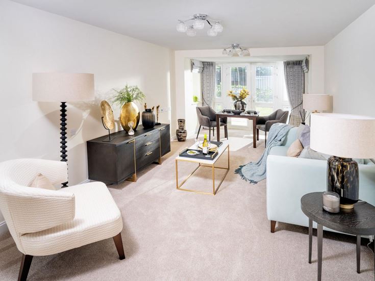 a living room with white furniture