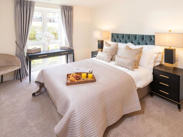 a bedroom with a bed and a table