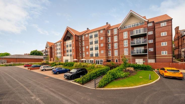 a building with cars parked in front