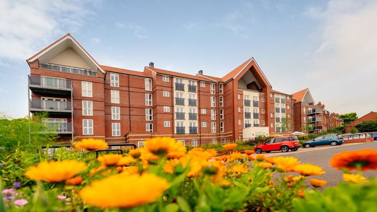 a building with cars parked in front