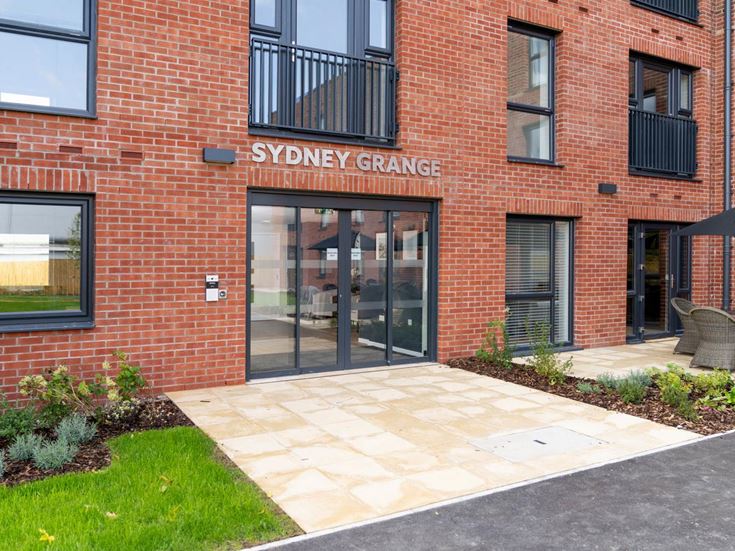 a brick building with a glass door