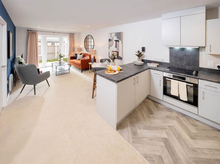 a kitchen with white cabinets