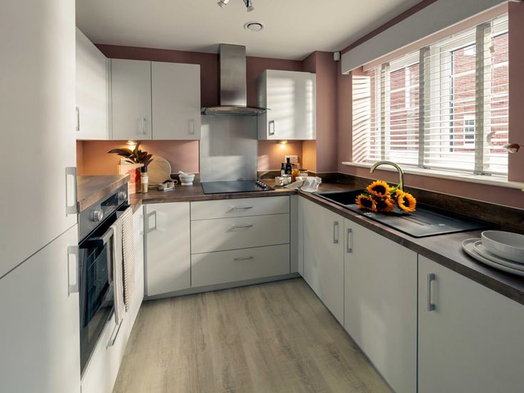 a kitchen with white cabinets