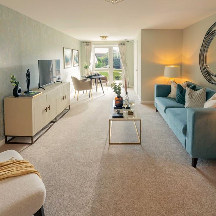 a living room with a couch and a mirror